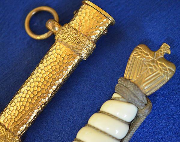 THIRD REICH NAVAL DAGGER WITH HAMMERED SCABBARD AND PLAIN BLADE, COMPLETE WITH GOLD KNOT.