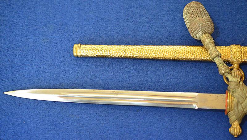 THIRD REICH NAVAL DAGGER WITH HAMMERED SCABBARD AND PLAIN BLADE, COMPLETE WITH GOLD KNOT.
