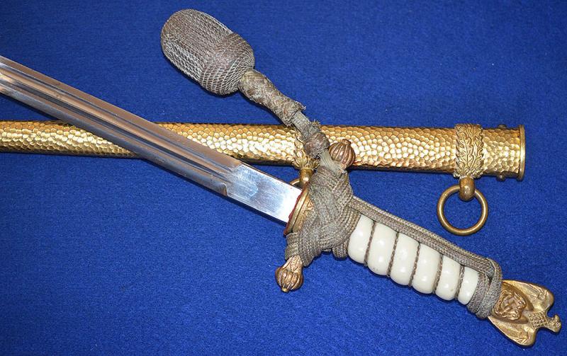 THIRD REICH NAVAL DAGGER WITH HAMMERED SCABBARD AND PLAIN BLADE, COMPLETE WITH GOLD KNOT.